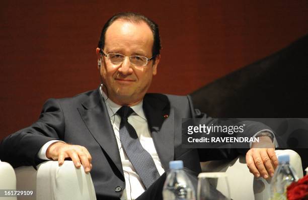 French President Francois Hollande looks on before giving a speech during a Madhavrao Scindia Foundation function in New Delhi on February 15, 2013....