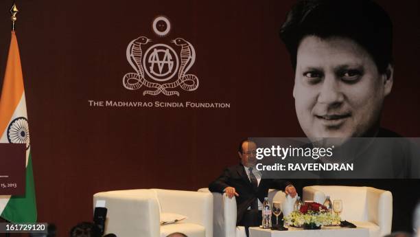 French President Francois Hollande looks on before giving a speech during a Madhavrao Scindia Foundation function in New Delhi on February 15, 2013....