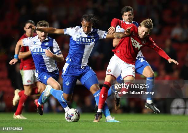 Josh Grant of Bristol Rovers battles for possession with Alfie May of Charlton Athletic during the Sky Bet League One match between Charlton Athletic...