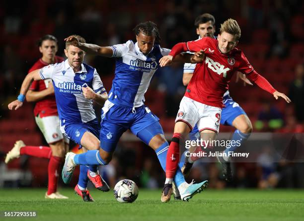 Josh Grant of Bristol Rovers battles for possession with Alfie May of Charlton Athletic during the Sky Bet League One match between Charlton Athletic...