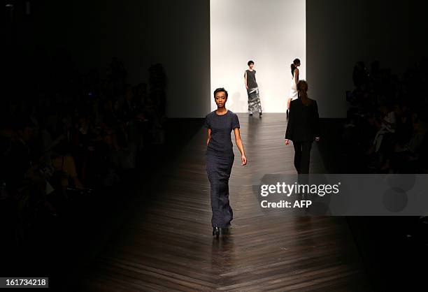 Models present creations by designer Zoe Jordan during the 2013 Autumn/Winter London Fashion Week in London on February 15, 2013. AFP PHOTO/ANDREW...