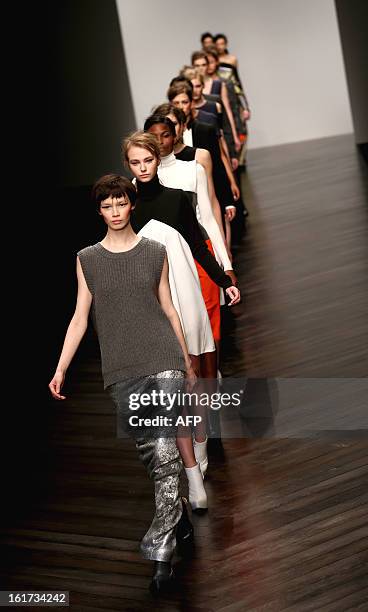 Models present creations by designer Zoe Jordan during the 2013 Autumn/Winter London Fashion Week in London on February 15, 2013. AFP PHOTO/ANDREW...