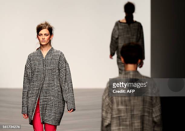 Model presents a creation by designer Zoe Jordan during the 2013 Autumn/Winter London Fashion Week in London on February 15, 2013. AFP PHOTO/ANDREW...