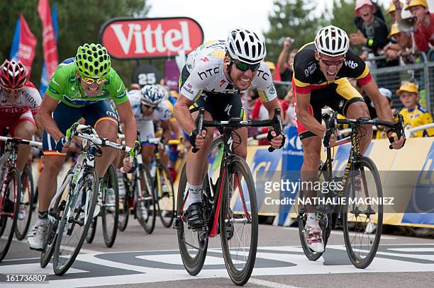 Stage winner, Britain's Mark Cavendish sprints on the finish line as he wins ahead of second-placed, Belgium's Philippe Gilbert , third-placed, Green...