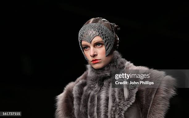 Model walks the runway at the Bora Aksu show during London Fashion Week Fall/Winter 2013/14 at Somerset House on February 15, 2013 in London, England.