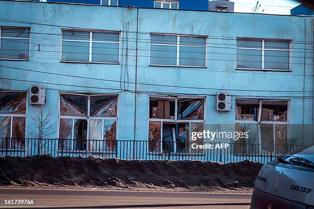 View of the facade of a local paint and varnish plant which was damaged by a shockwave from a meteor in the Urals city of Chelyabinsk, on February...