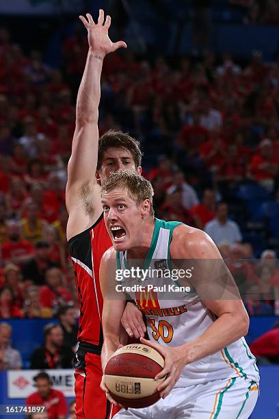 Luke Nevill of the Crocodiles pulls down a rebound during the round 19 NBL match between the Perth Wildcats and the Townsville Crocodiles at Perth...