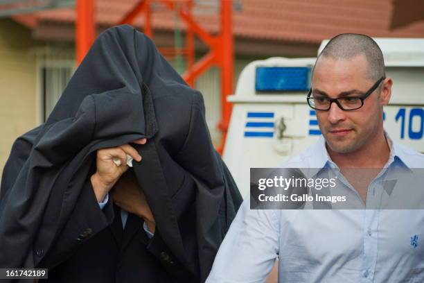 Oscar Pistorius with his brother, Carl Pistorius attends the Pretoria Magistrate court on February 15 in Pretoria, South Africa. Oscar Pistorius...