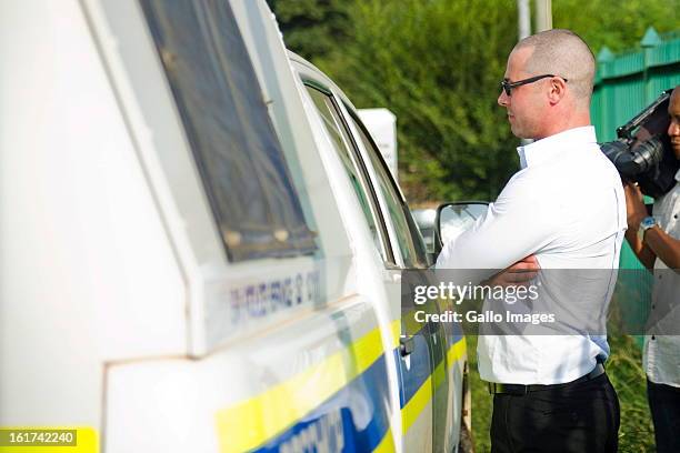 Carl Pistorius attends the Pretoria Magistrate court on February 15 in Pretoria, South Africa. Oscar Pistorius stands accused of murder after...