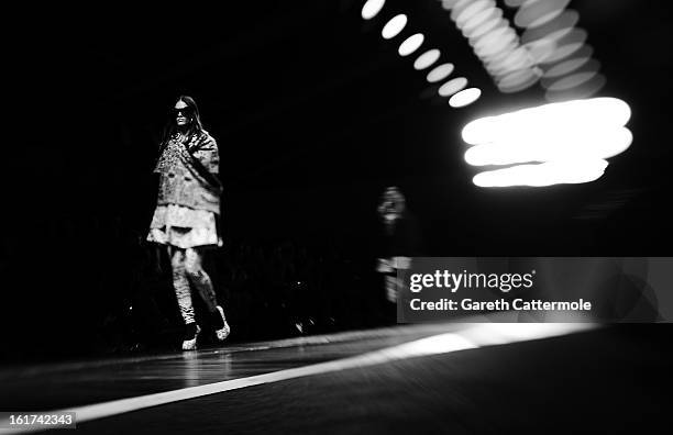 Model walks the runway during the KTZ show as part of London Fashion Week Fall/Winter 2013/14 at Somerset House on February 15, 2013 in London,...