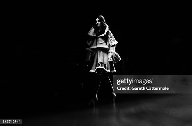 Model walks the runway during the KTZ show as part of London Fashion Week Fall/Winter 2013/14 at Somerset House on February 15, 2013 in London,...