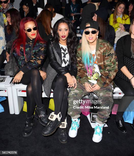 Courtney Rumbold, Alexandra Buggs and Karis Anderson of the band Stooshe attend the KTZ show during London Fashion Week Fall/Winter 2013/14 at...