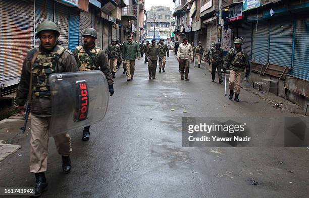 Indian paramilitary soldiers patrol streets in main city during a strict curfew on the seventh consecutive day, imposed after the execution of...