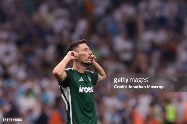 Filip Mladenovic of Panathinaikos FC silences the crowd after scoring the decisive penalty in the shoot out in the UEFA Champions League Third...