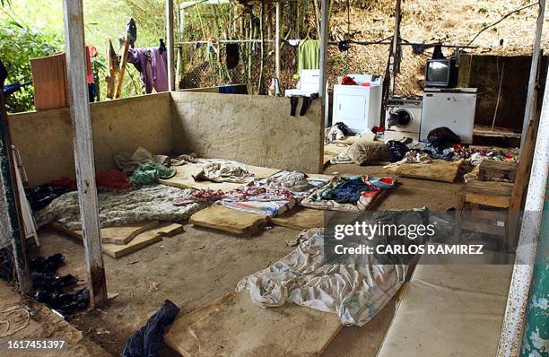 View of the belongings of alleged Colombian paramilitary members, after their arrest in Daktari farm, east of Caracas 09 May 2004. Venezuelan...