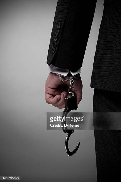 handcuffs - snatch stock pictures, royalty-free photos & images