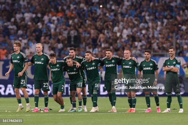 Panathinaikos players react during the penalty shoot out of the UEFA Champions League Third Qualifying Round 2nd Leg match between Olympique de...
