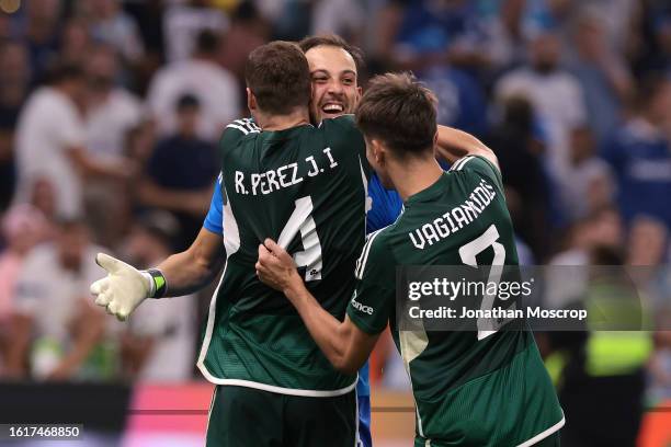 Alberto Brignoli of Panathinaikos FC celebrates with team mates Ruben Perez and Georgios Vagiannidis following the penalty shoot out victory in the...