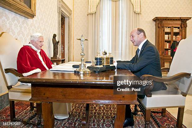 Pope Benedict XVI receives President of Romania Traian Basescu at his private library on February 15, 2013 in Vatican City, Vatican.