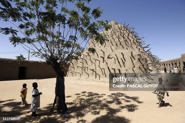 Children play beside the tomb of the Askia on February 15, 2013 in Gao, northern Mali. The European Union on Friday announced fresh aid worth 20...