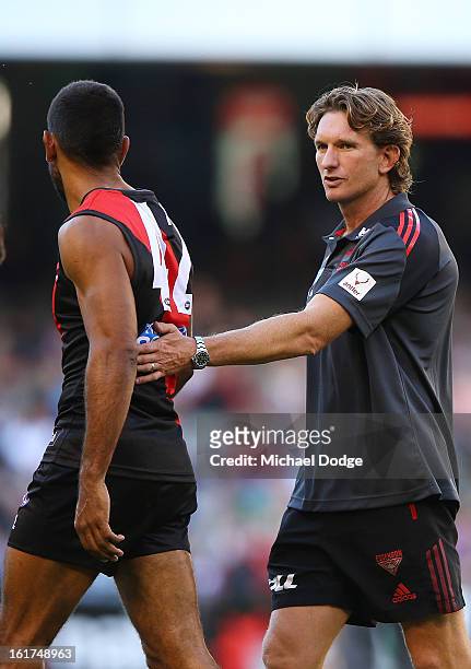 Coach James Hird pats Nathan Lovett-Murray on the back during the round one AFL NAB Cup match between the Essendon Bombers and the Western Bulldogs...