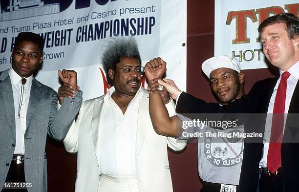 Tyrell Biggs; Promoter Don King, Mike Tyson and Donald Trump pose during the press conference to promote their upcoming fight in New York.