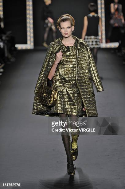 Model walks the runway at the Anna Sui Ready to Wear Fall/Winter 2013-2014 fashion show during Mercedes-Benz Fashion Week at The Theatre at Lincoln...