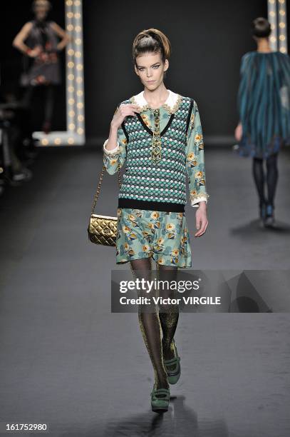 Model walks the runway at the Anna Sui Ready to Wear Fall/Winter 2013-2014 fashion show during Mercedes-Benz Fashion Week at The Theatre at Lincoln...