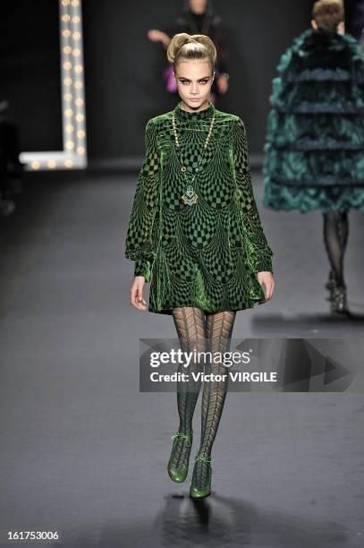 Cara Delevingne walks the runway at the Anna Sui Ready to Wear Fall/Winter 2013-2014 fashion show during Mercedes-Benz Fashion Week at The Theatre at...