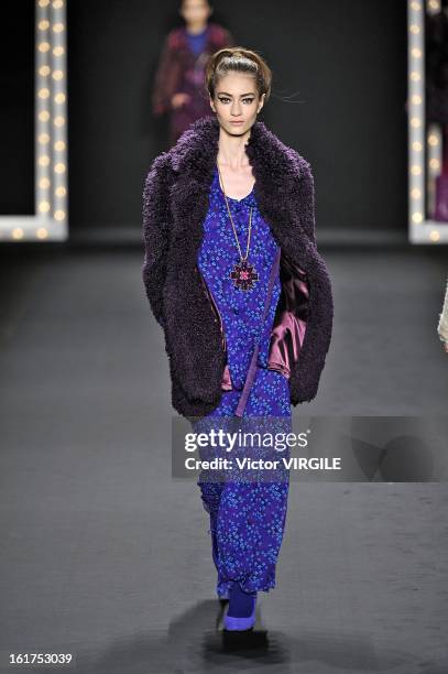 Model walks the runway at the Anna Sui Ready to Wear Fall/Winter 2013-2014 fashion show during Mercedes-Benz Fashion Week at The Theatre at Lincoln...