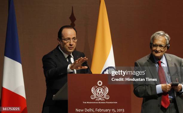 French President Francois Hollande before honoring Amartya Sen, with Commandeur de la Legion d' Honneur during the Madhavrao Scindia foundation...