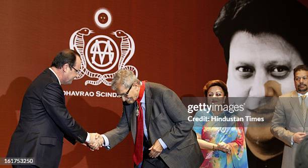 French President Francois Hollande honoring Amartya Sen with Commandeur de la Legion d' Honneur as wife of late Madhavrao Scindia, Madhavi raje...