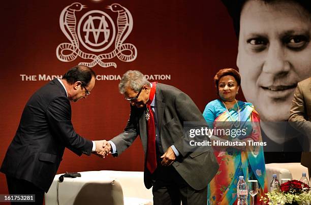 French President Francois Hollande honoring Amartya Sen with Commandeur de la Legion d' Honneur as wife of late Madhavrao Scindia, Madhavi Raje...