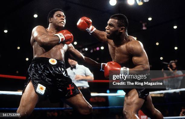 Mike Tyson throws a punch against Trevor Berbick during the fight at Hilton Hotel in Las Vegas, Nevada. Mike Tyson won the WBC heavyweight title by a...