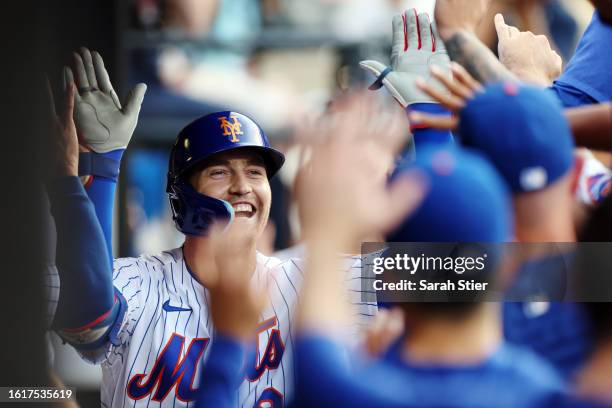 Brandon Nimmo of the New York Mets celebrates in the dugout after hitting a solo home run during the first inning against the Pittsburgh Pirates at...