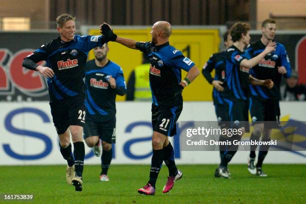 Tobias Feisthammel of Paderborn celebrates with teammate Daniel Brueckner after scoring his team's first goal during the Second Bundesliga match...