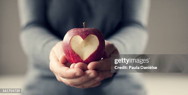 apple love - healthy heart stock pictures, royalty-free photos & images