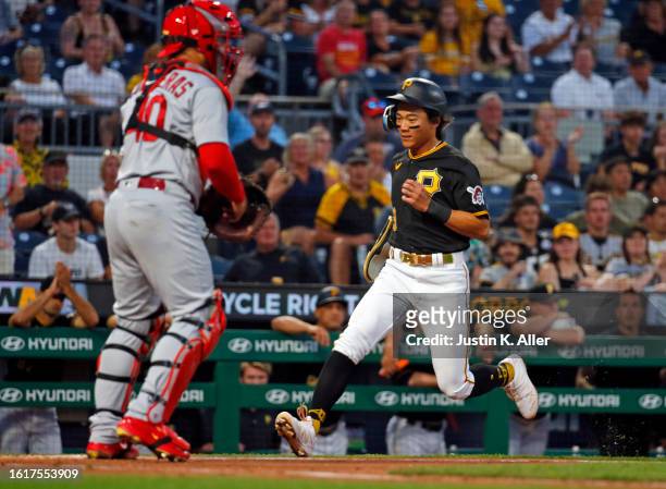 Ji Hwan Bae of the Pittsburgh Pirates scores on an RBI single in the fourth inning against the St. Louis Cardinals at PNC Park on August 22, 2023 in...