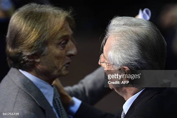 Ferrari President Luca di Montezemolo is greeted by Italy's outgoing Prime Minister Mario Monti during a rally of the centrist electoral coalition...