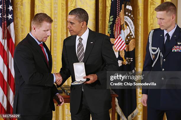 President Barack Obama presents Army veteran and Veterans Farm founder Adam Burke with the 2012 Presidential Citizens Medal, the nation's...