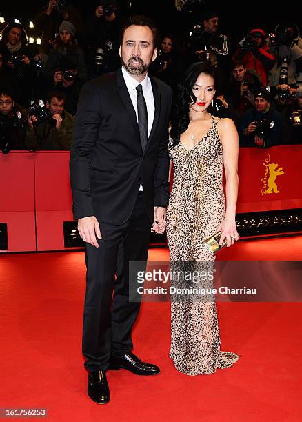 Nicolas Cage and wife Alice Kim attend the 'The Croods' Premiere during the 63rd Berlinale International Film Festival at Berlinale Palast on...