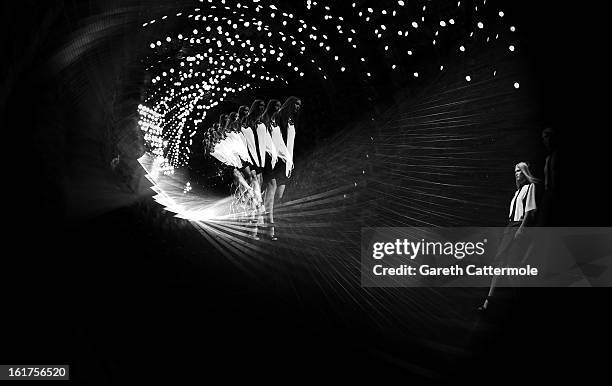 Models walk the runway during the Jean-Pierre Braganza show as part of London Fashion Week Fall/Winter 2013/14 at Somerset House on February 15, 2013...