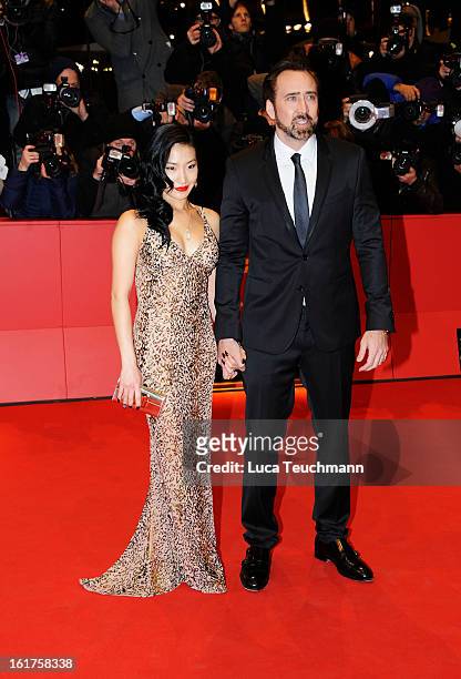 Nicolas Cage and wife Alice Kim attend the 'The Croods' Premiere during the 63rd Berlinale International Film Festival at Berlinale Palast on...