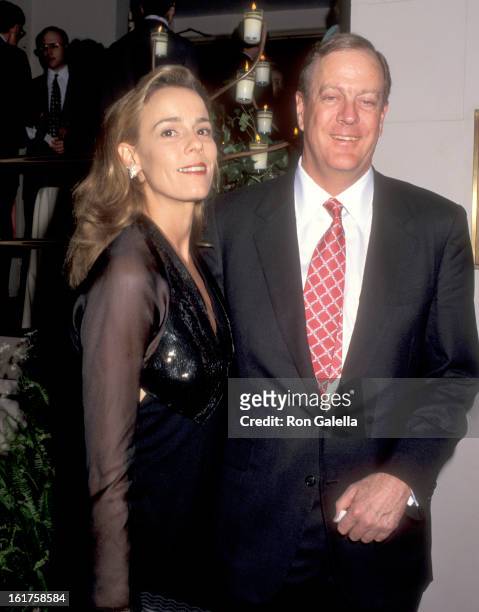 Businessman David H. Koch and guest Julia Flesher attend An Evening of Fashion by Celine - Benefit for Gods Love We Deliver on May 23, 1995 at City...