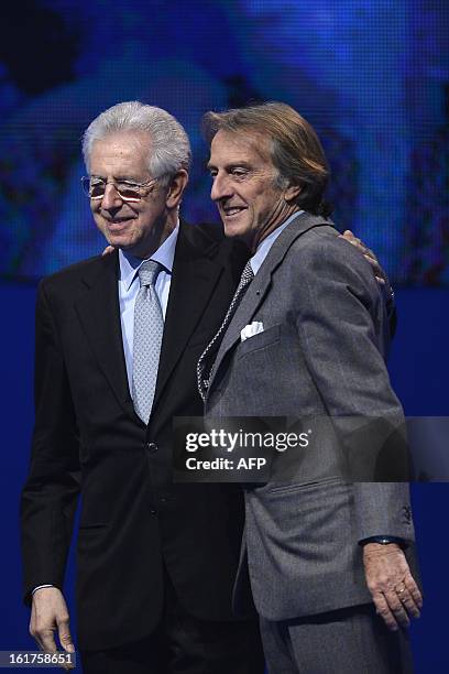 Ferrari President Luca di Montezemolo and Italy's outgoing Prime Minister Mario Monti pose at the end of a rally of the centrist electoral coalition...