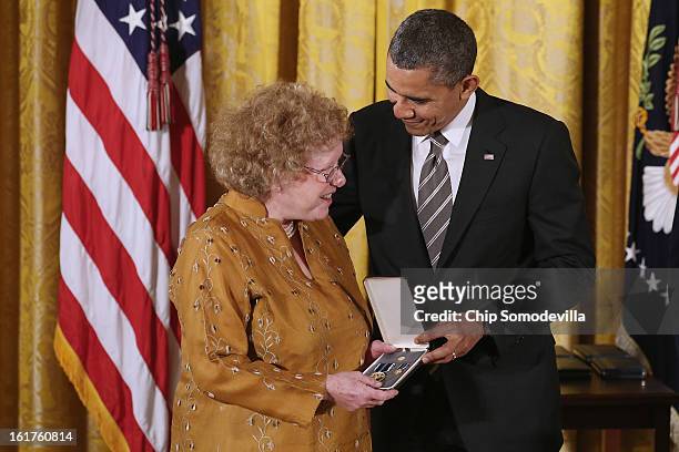 President Barack Obama presents Parents, Families and Friends of Lesbians and Gays co-founder Jeanne Manford's daughter Suzzane Swan with the...