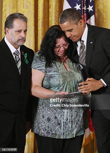 President Barack Obama presents Donna and Carlos Soto Sr. With the 2012 Presidential Citizens Medal, the nation's second-highest civilian honor, on...
