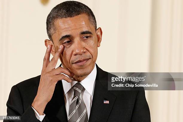 President Barack Obama wipes a tear from the corner of his eye before presenting recepients with the 2012 Presidential Citizens Medal, the nation's...