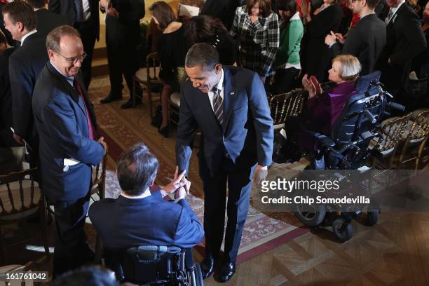 President Barack Obama greets guests after presenting recepients with the 2012 Presidential Citizens Medal, the nation's second-highest civilian...