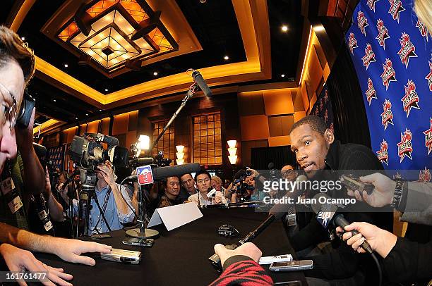Kevin Durant of the Oklahoma City Thunder speaks with reporters during media availability as part of the 2013 NBA All-Star Weekend at the Hilton...